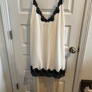 Elegant White Hi-Lo Slip Dress with Black Lace Trim